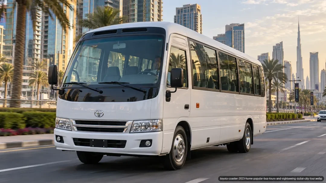 White Toyota Coaster minibus travelling through Dubai with the Burj Khalifa skyline